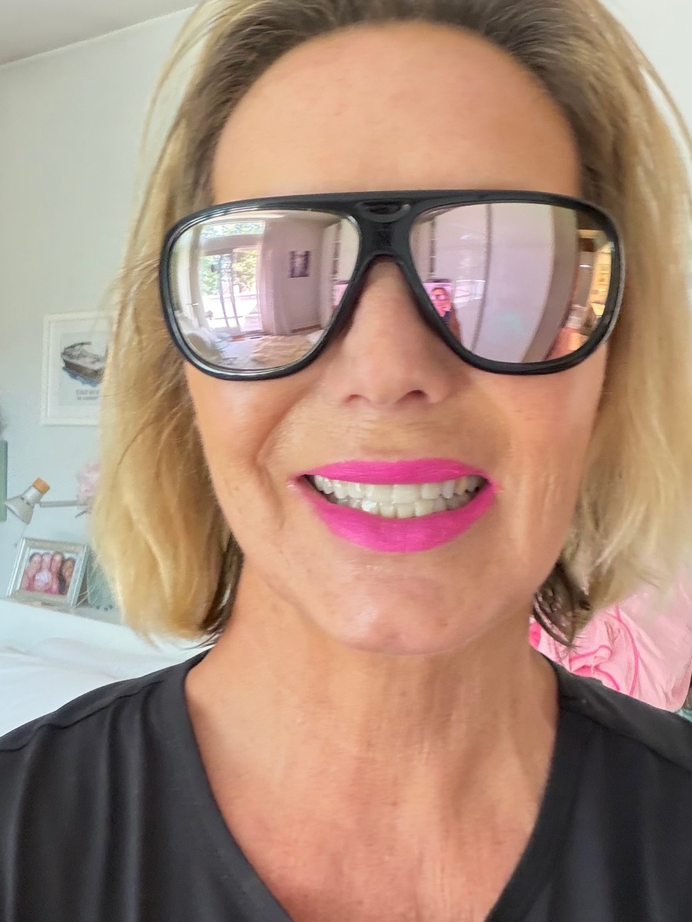 Oakley Black Frame Sunglasses with Pink Mirrored Lenses